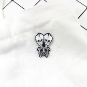 Conjoined skull Brooch