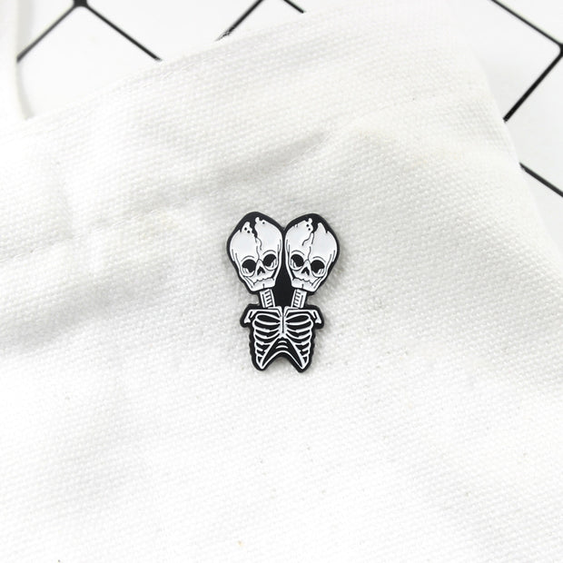 Conjoined skull Brooch