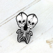 Conjoined skull Brooch