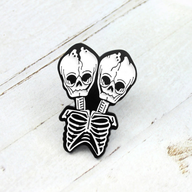 Conjoined skull Brooch
