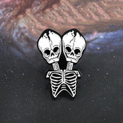 Conjoined skull Brooch