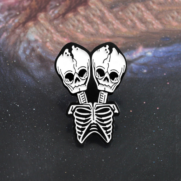 Conjoined skull Brooch