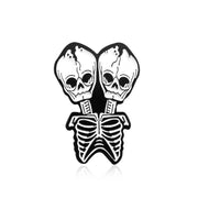 Conjoined skull Brooch